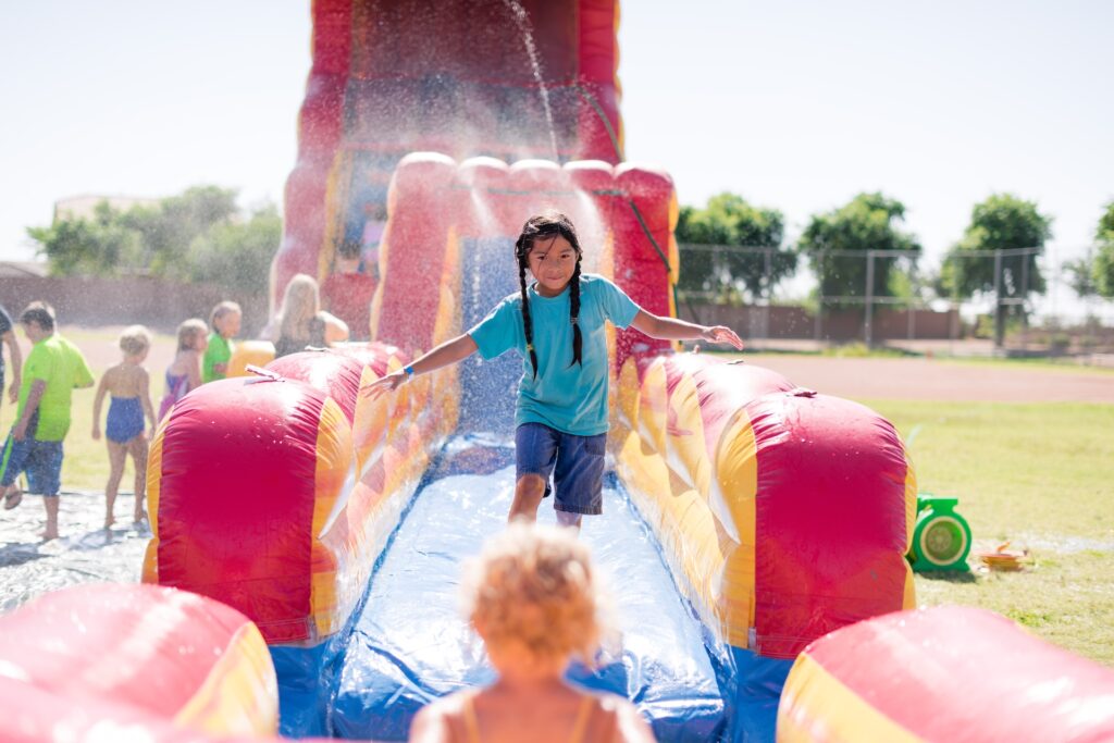 girl enjoying a water slide 2024 12 02 10 20 30 utc
